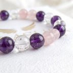 Woman wearing rose quartz amethyst clear quartz bracelet - handmade women's crystal bracelet for emotional balance