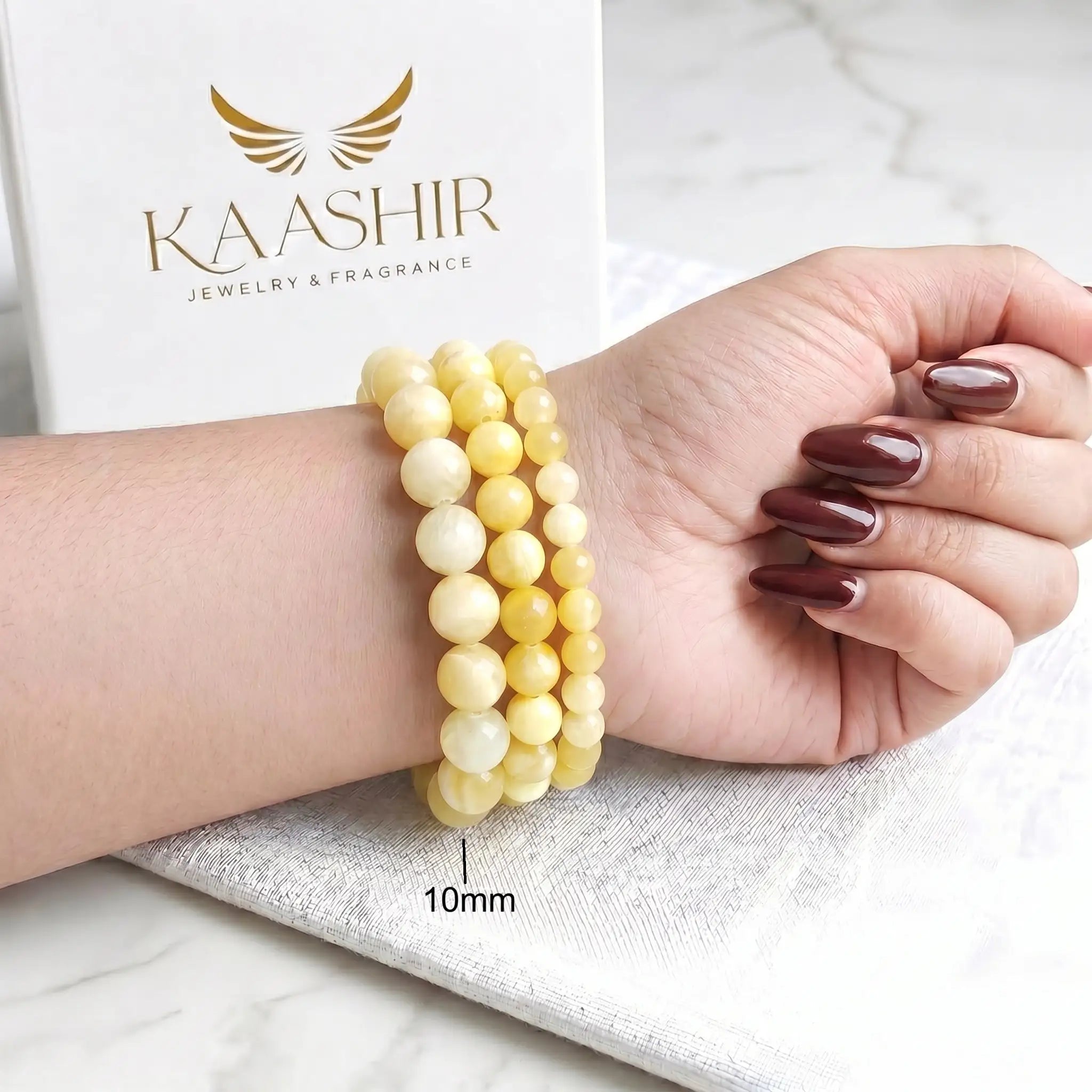 yellow Jade 10mm Beaded Gemstone Bracelet worn on wrist – Kaashir Jewelry