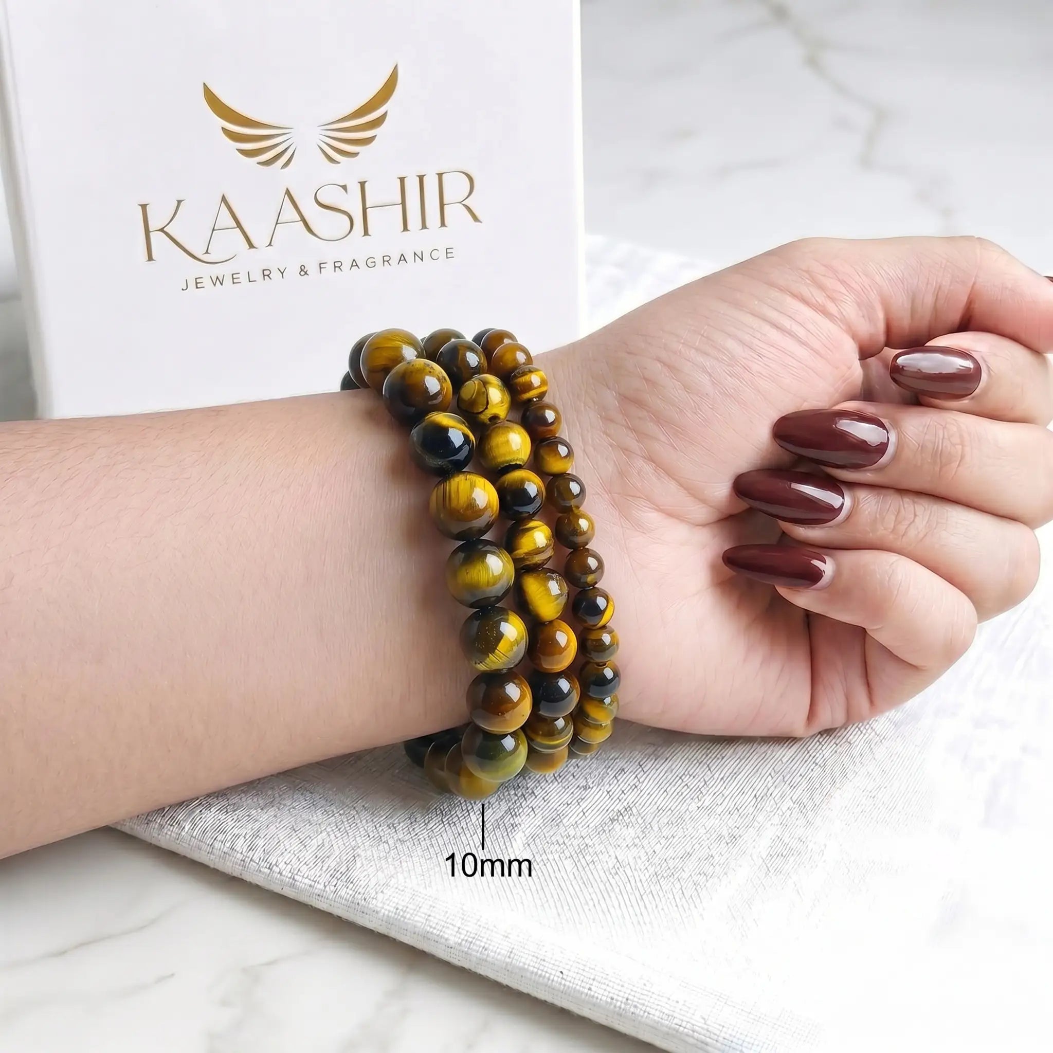 Yellow Tiger Eye 10mm Beaded Gemstone Bracelet worn on wrist – Kaashir Jewelry
