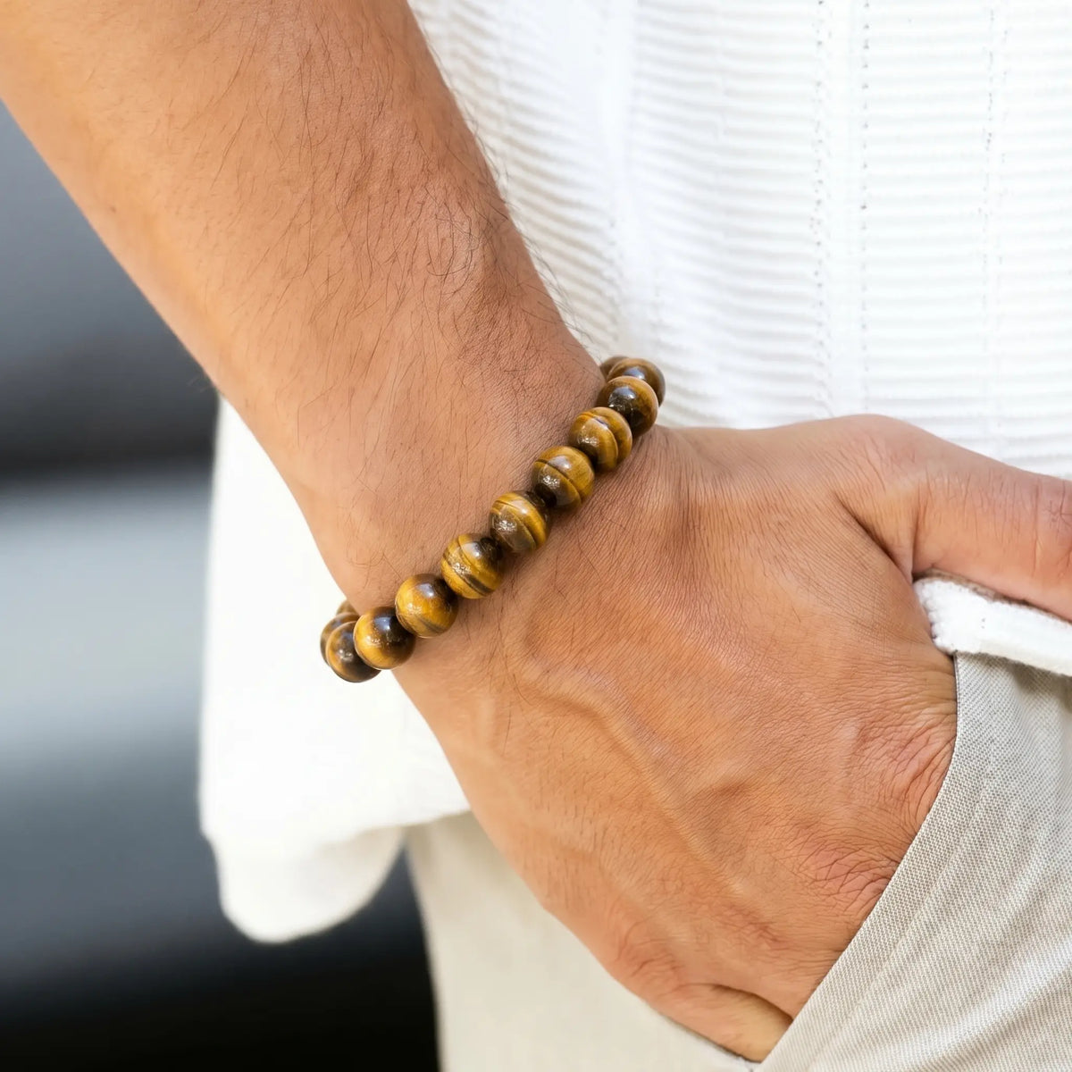 Yellow Tiger Eye 10mm Beaded Gemstone Bracelet worn on wrist – Kaashir Jewelry