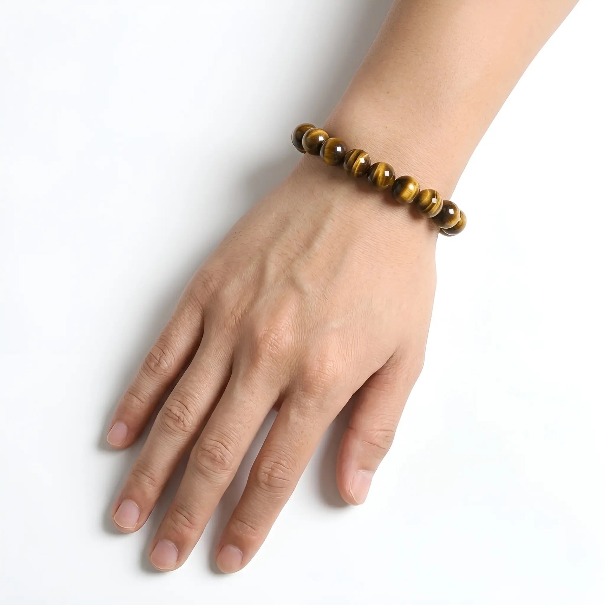 Yellow Tiger Eye 10mm Beaded Gemstone Bracelet worn on wrist – Kaashir Jewelry