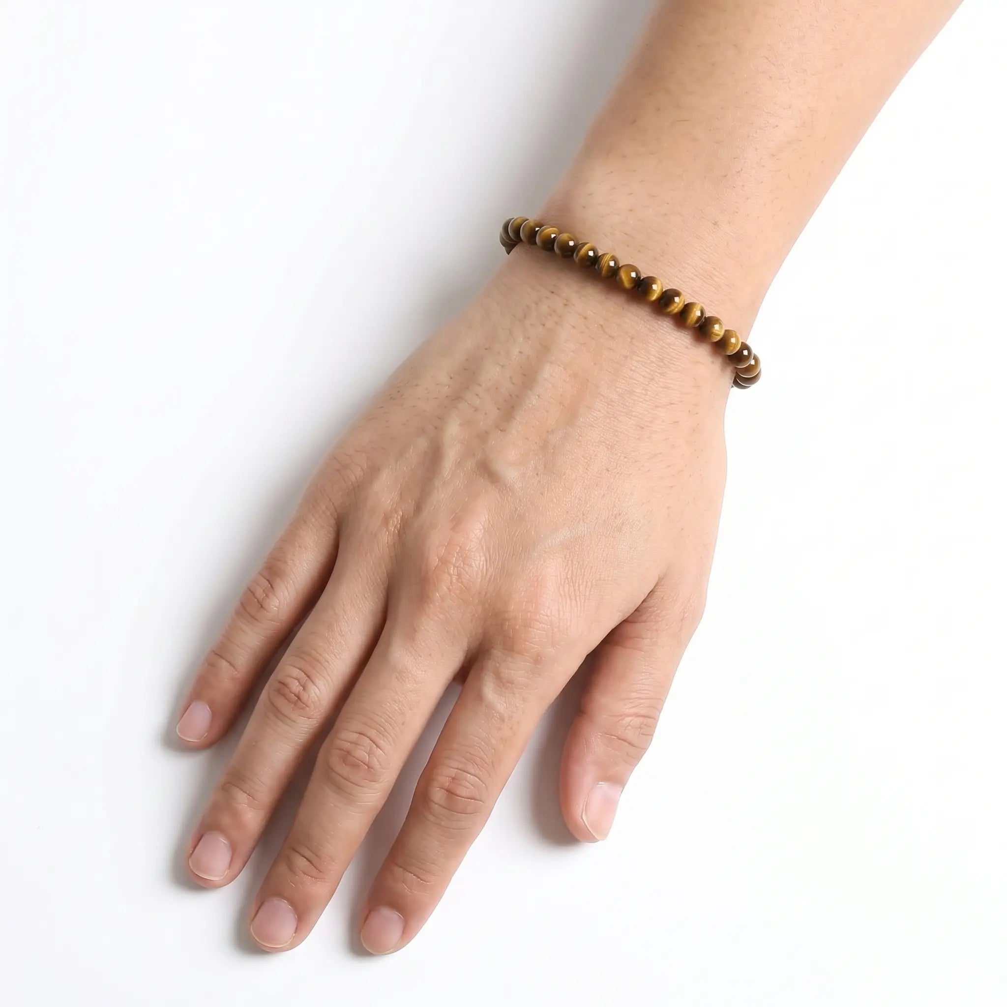 Yellow Tiger Eye 6mm Beaded Gemstone Bracelet worn on wrist – Kaashir Jewelry