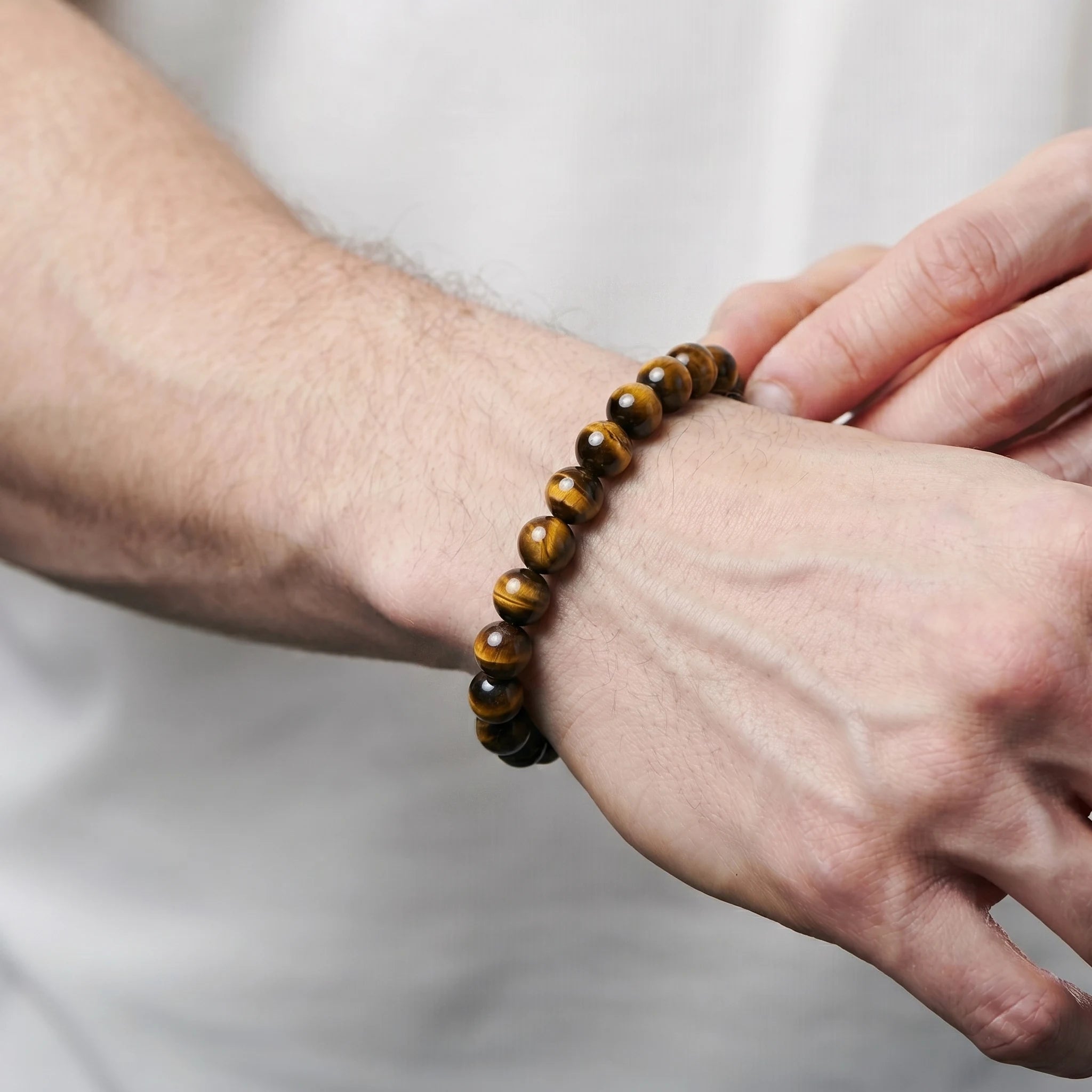 Yellow Tiger Eye 8mm Beaded Gemstone Bracelet worn on wrist – Kaashir Jewelry