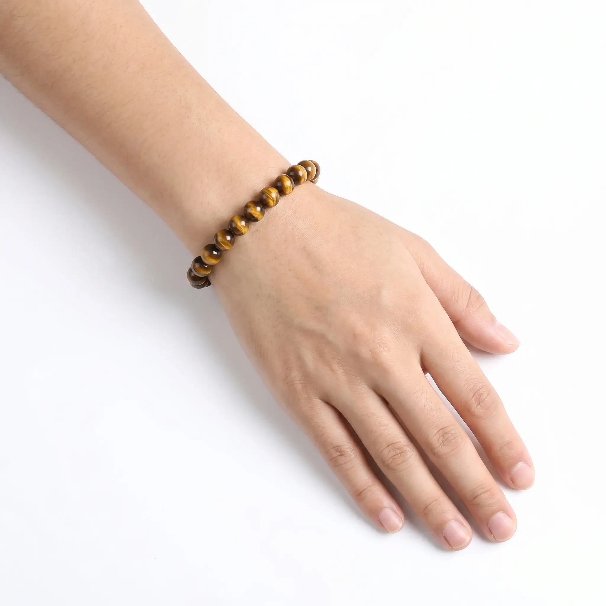 Yellow Tiger Eye 8mm Beaded Gemstone Bracelet worn on wrist – Kaashir Jewelry