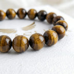 yellow tiger eye bracelet natural stone beads close up detail