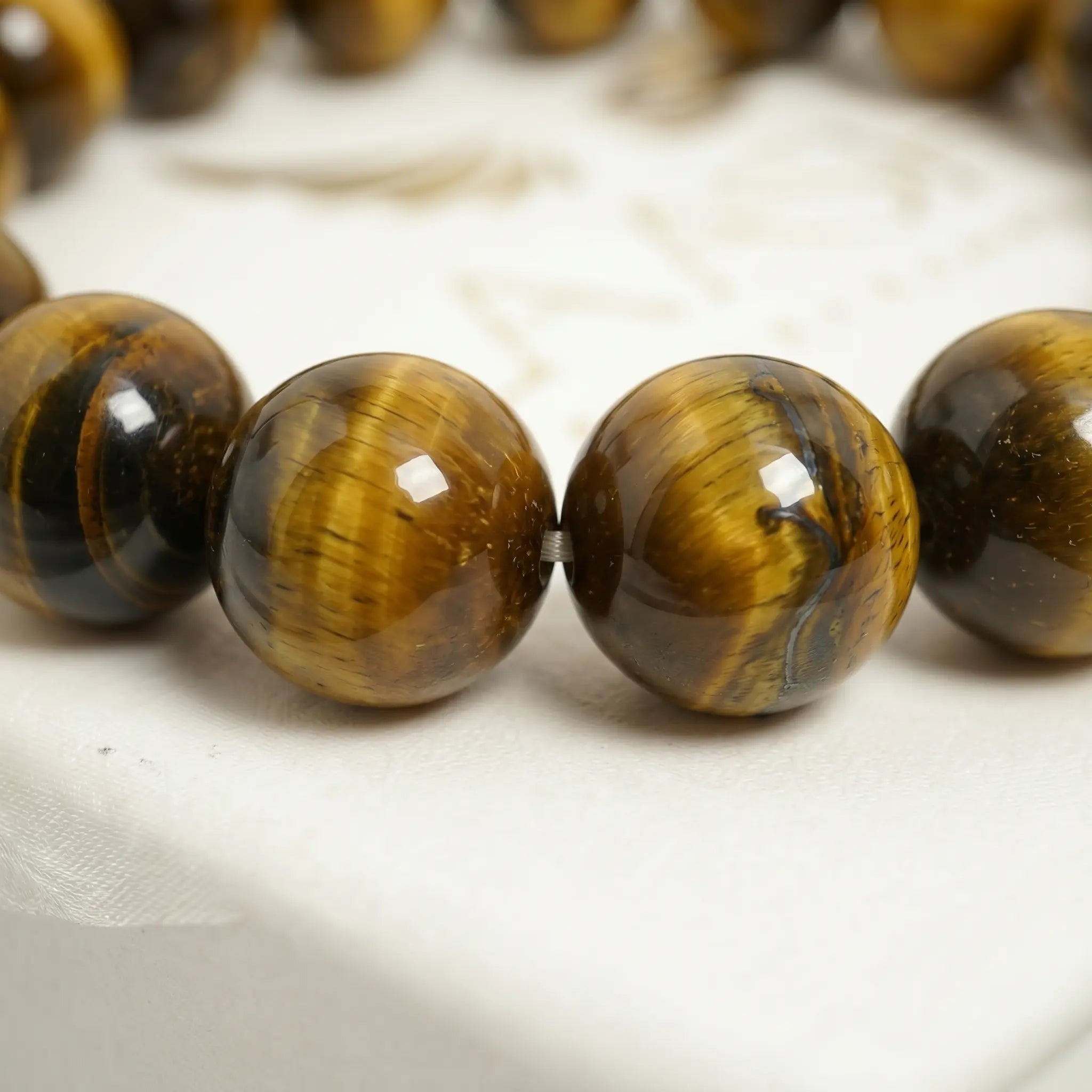yellow tiger eye bracelet natural stone beads close up detail