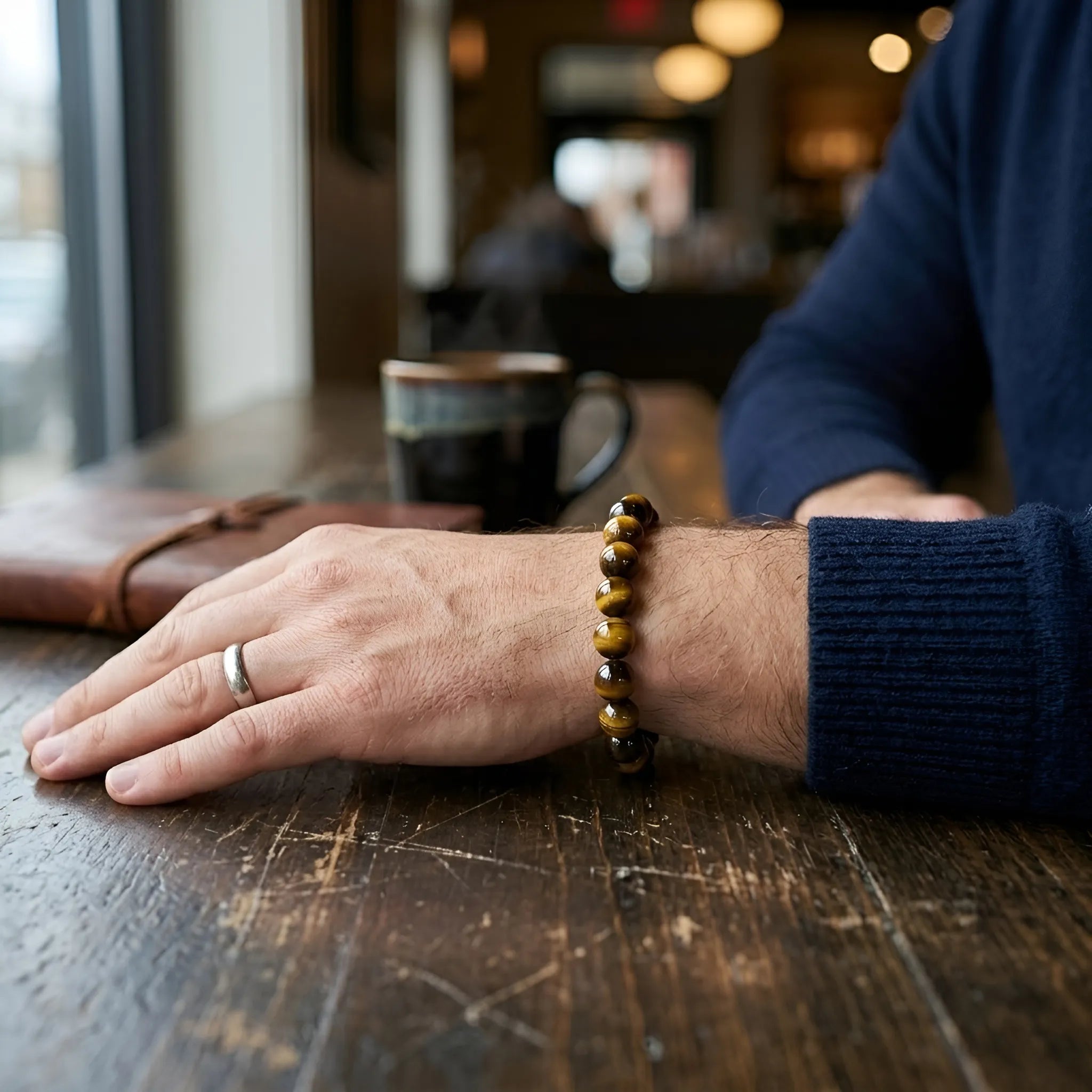 Yellow tiger eye bracelet worn on wrist for men and women stretch fit gemstone jewelry